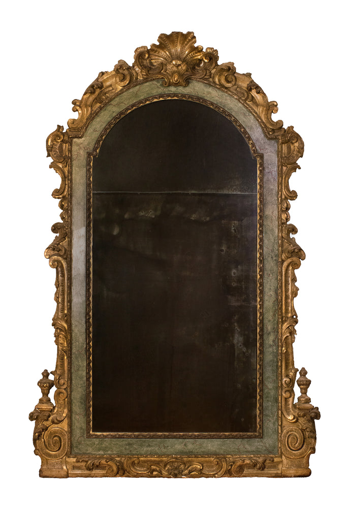 Italian 18th century Rococo archtop painted and gilded mirror. The frame is decorated with gold leaf c-scroll leaves and urns with a shell sculpted and carved molding. It has marbleized painted inlay with muted colors of blue, green, and gray with wine veining creating a marble effect.
