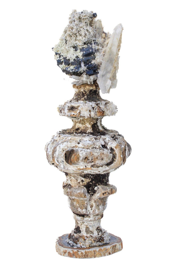 17th century Italian vase with black tourmaline and crystals on a petrified wood base.