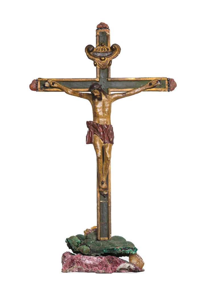 18th century Italian crucifix mounted on green malachite from Congo, calcite with fluorite from Spain, and raspberry garnet from Mexico. The piece is adorned with Carnelian pebbles from India and garnet from the US. 