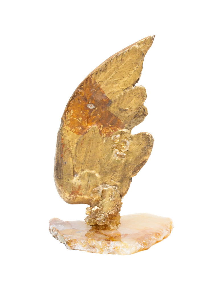 18th century Italian hand-carved gilded angel wing adorned with citrine and quartz crystals and mounted on a polished hematoid slab. 