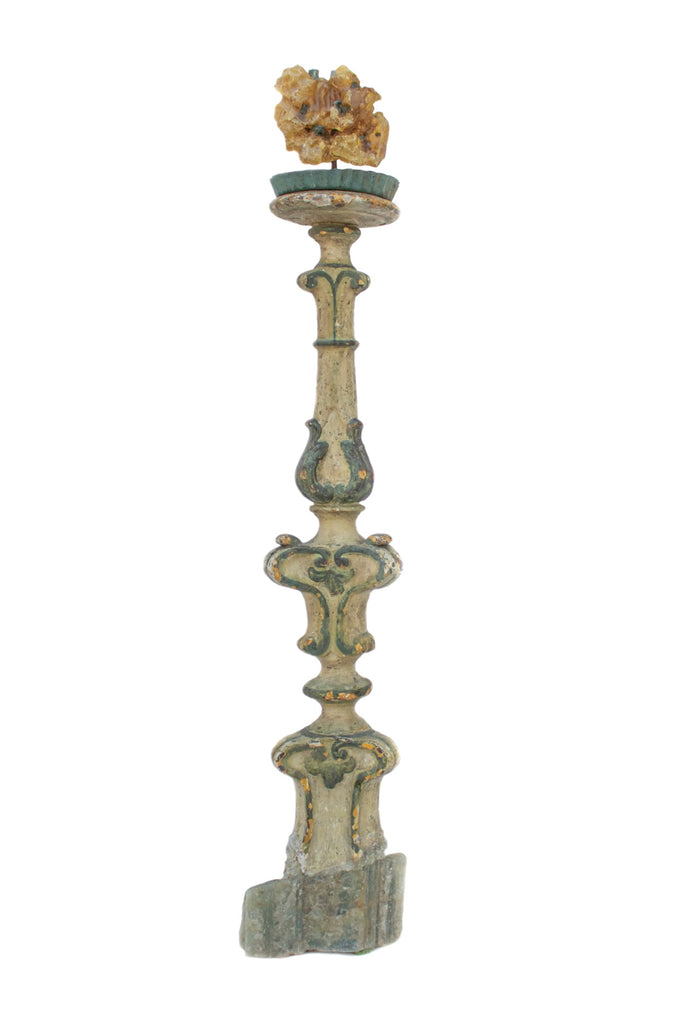 18th century Italian candlestick with amber and aquamarine points on an aquamarine base. The candlestick artifact is originally from a church in Tuscany. It is hand-carved and hand-painted with evergreen and pale green pigments, and orange undercoat showing through. The colors of the candlestick perfectly coordinate with the aquamarine and amber.