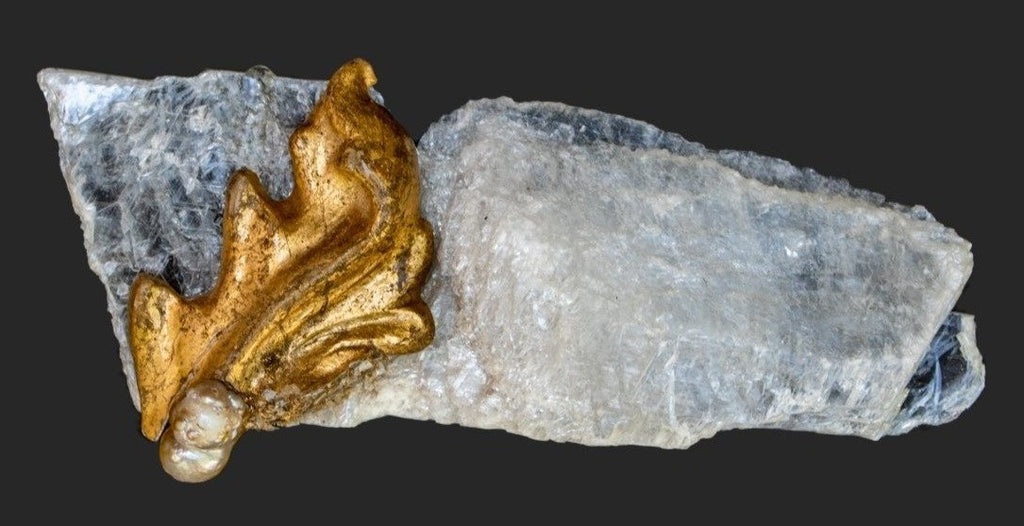 18th century Italian gold leaf fragment with a natural-forming baroque pearl on a selenite slab.