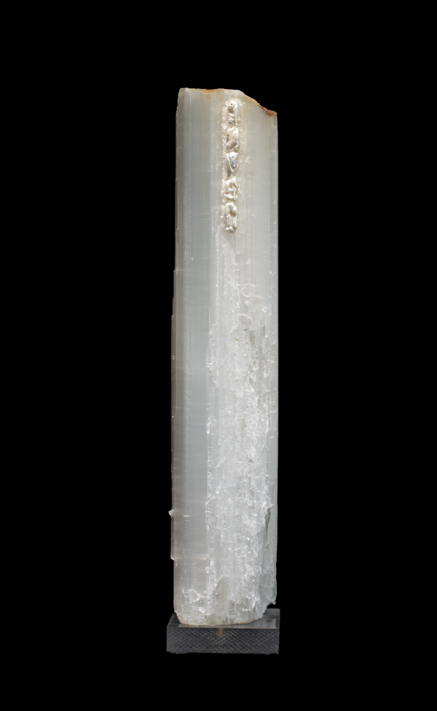 Ruler Selenite with natural forming baroque pearls on a lucite base. Ruler selenite or "selenite logs" are single, prismatic selenite crystals from Morocco that were formed in extensive beds by the evaporation of ocean brine. This mineral is characterized by a silky, pearly luster called satin spare. It is then adorned with the baroque pearls which coordinate beautifully with the sleek selenite.