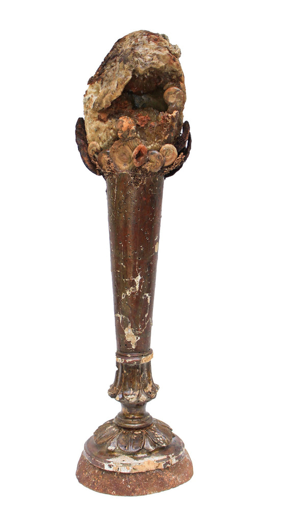 18th century Italian candlestick base with a prehistoric geode, amonites, chalcedonian rosettes and surrounded by antique metal foliage. The piece is mounted onto an agate slice. 